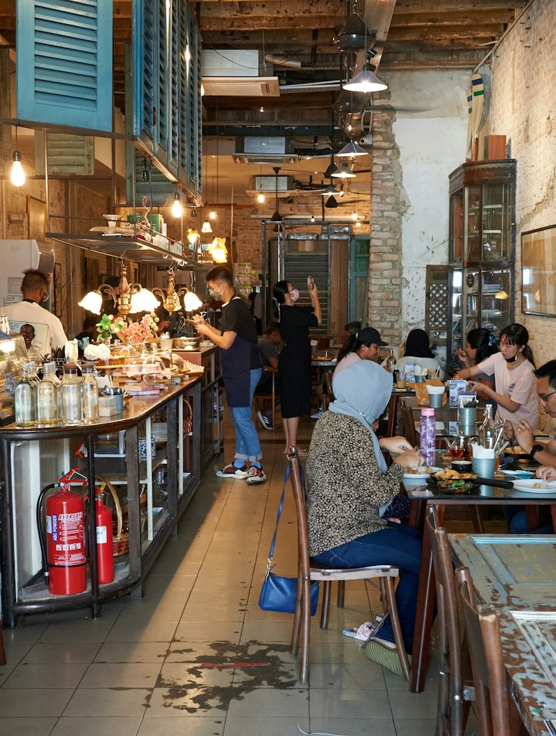 People dining in a cosy cafe in Kuala Lumpur