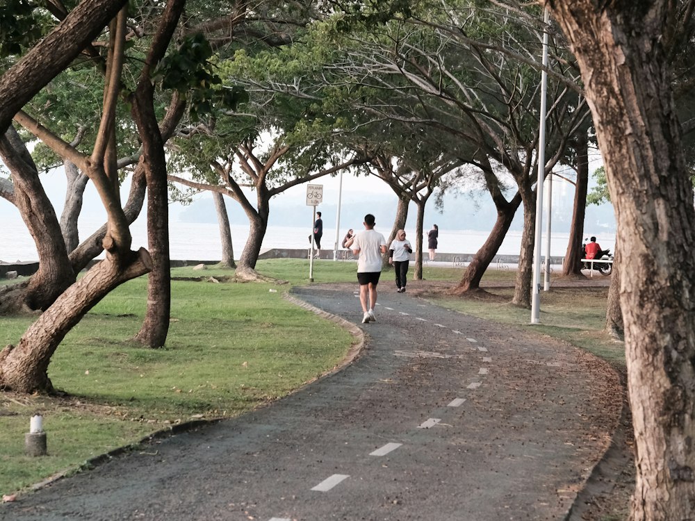 People running along a park path in Malaysia